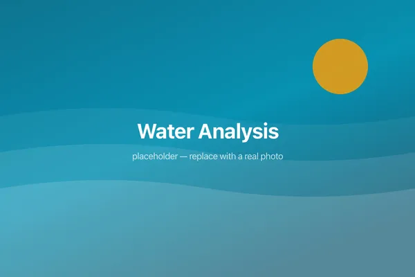 Digital water testing equipment beside a pool